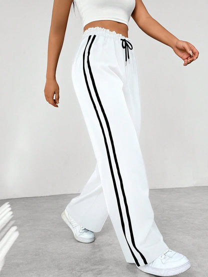 Pantaloni jogging da donna comodi con strisce laterali - Pantaloni sportivi e casual dal taglio morbido