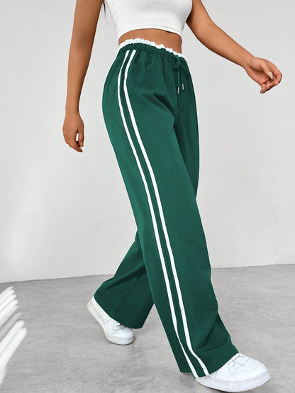 Pantaloni jogging da donna comodi con strisce laterali - Pantaloni sportivi e casual dal taglio morbido