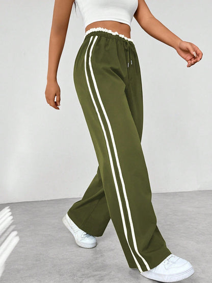 Pantaloni jogging da donna comodi con strisce laterali - Pantaloni sportivi e casual dal taglio morbido