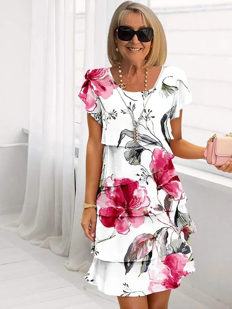Stile estivo elegante per donne, vestito con motivo floreale e volant femminili per giornate leggere